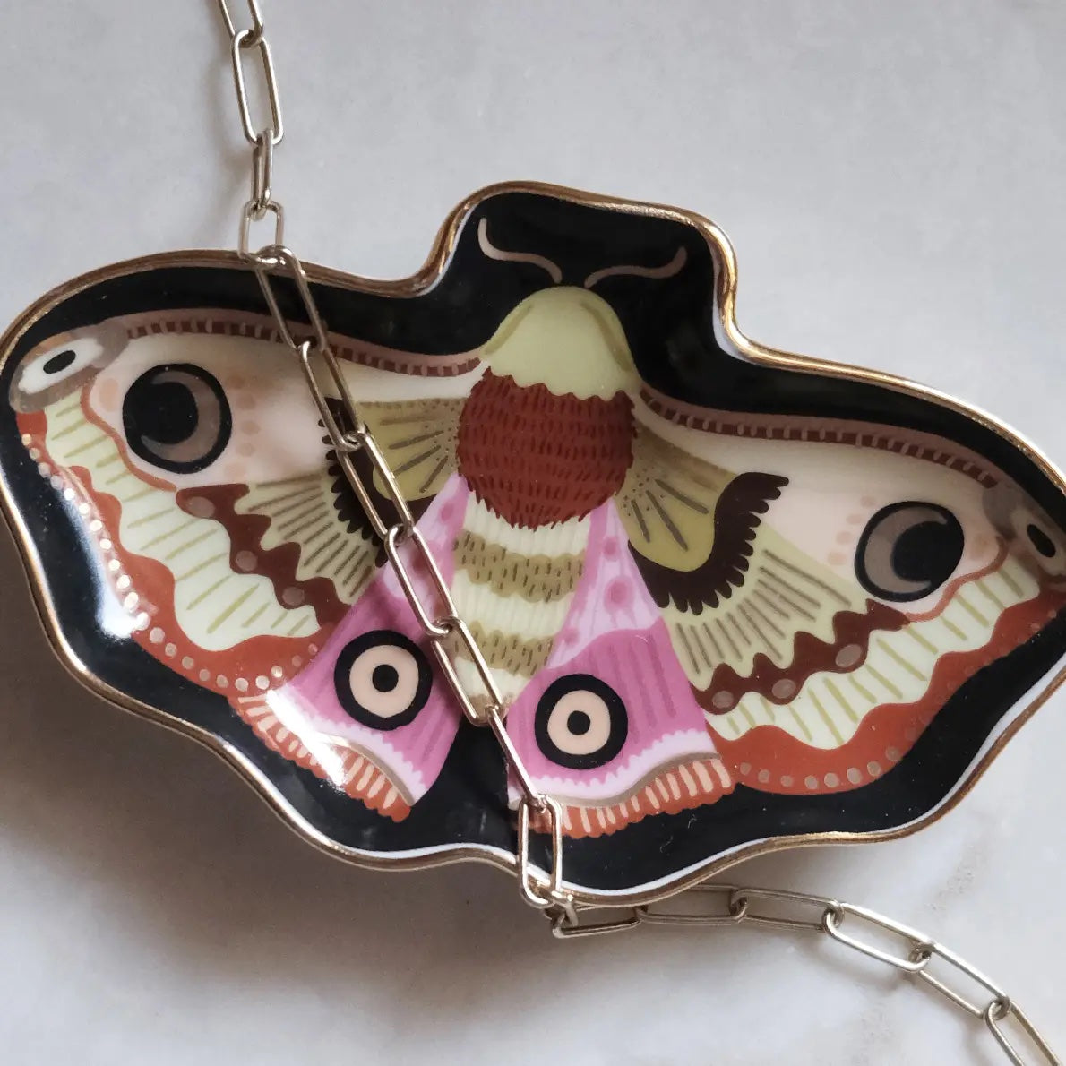 Butterfly-shaped keychain with intricate design on a light background | Idlewild Moon Moth Porcelain Trinket Dish