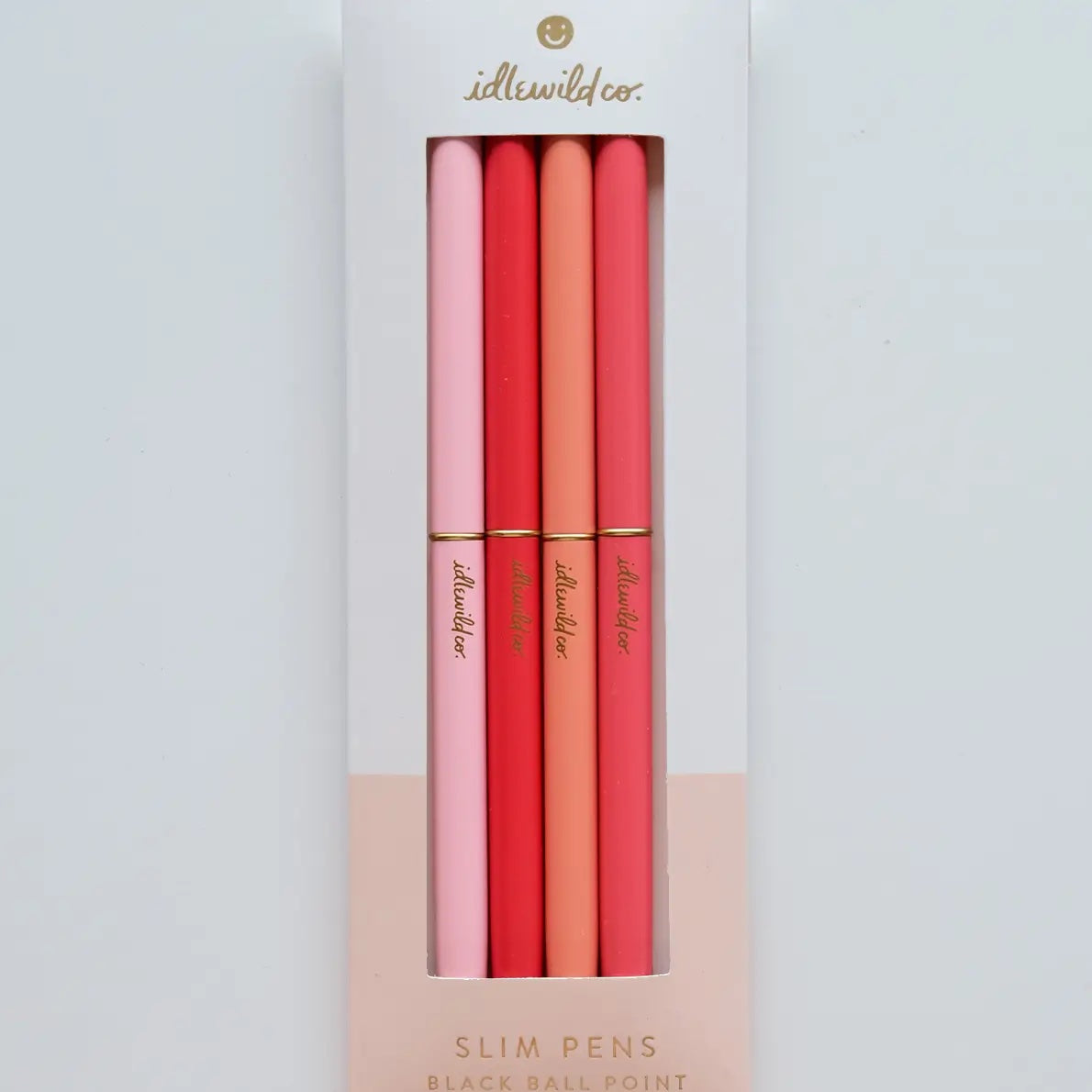 Set of four slim pens in pink and orange packaging with 'illewild' branding on a light gray background | Idlewild Slim Pen | Spectrum Poppies