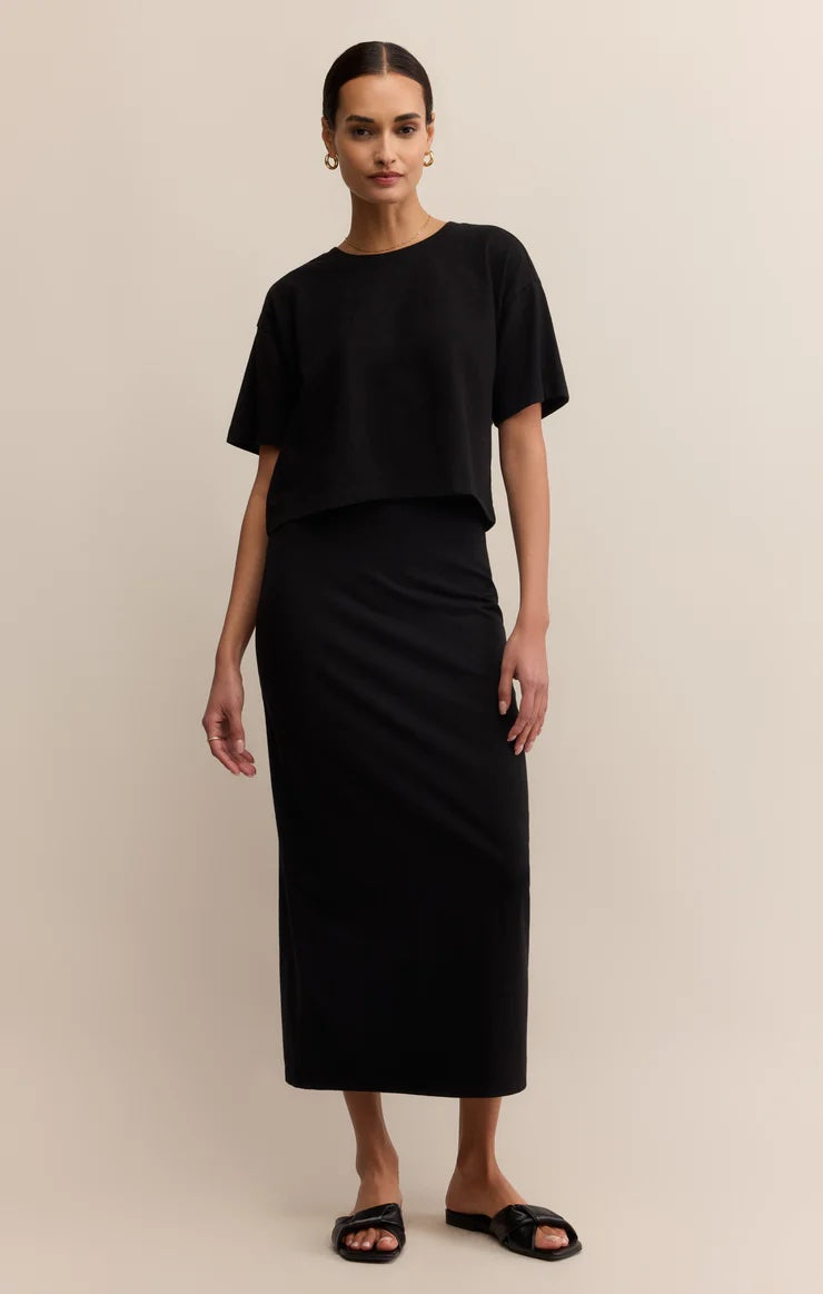Woman wearing a black outfit on a beige background | Z Supply On The Go Tee | Black