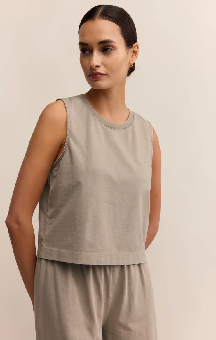 Woman wearing a beige sleeveless top and pants against a plain background | Z Supply Sloane Jersey Muscle Tank | Retreat
