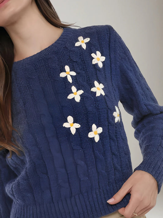 Blue sweater with white floral patterns on a neutral background | Sadie and Sage | Lulu Embroidered Daisy Sweater, Navy