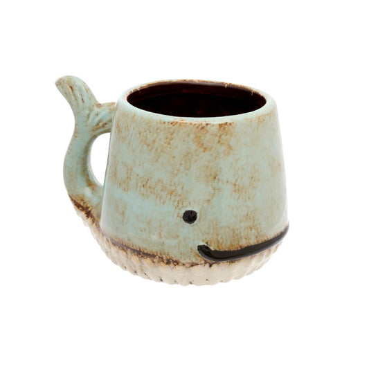 Ceramic mug shaped like a whale with a white background