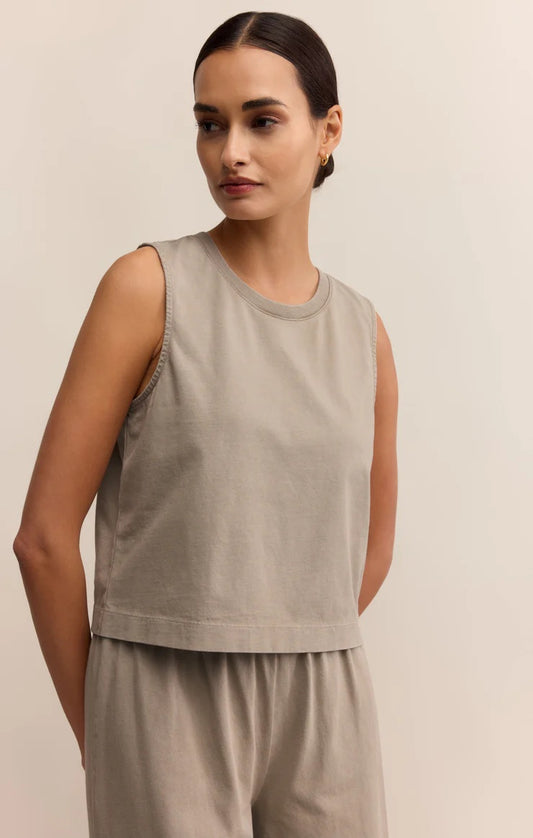 Woman wearing a beige sleeveless top and pants against a plain background | Z Supply Sloane Jersey Muscle Tank | Retreat