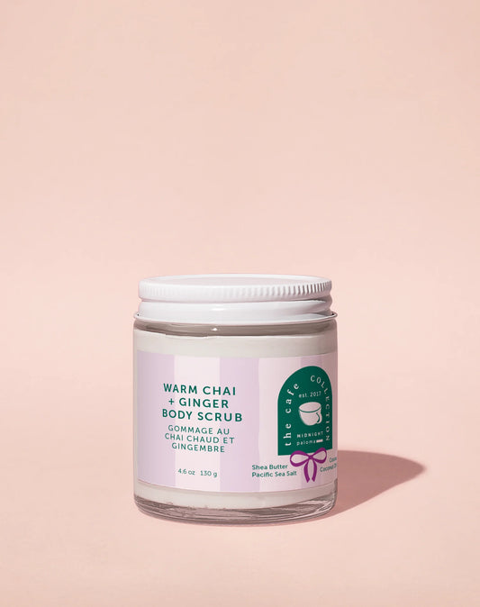 Jar of warm chai and ginger body scrub on a pink background