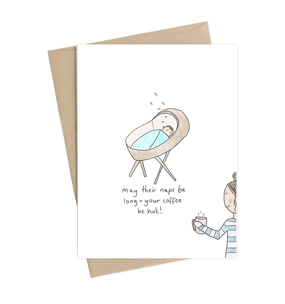 Greeting card with illustration of a baby in a crib and a person holding a coffee cup, with text 'May their naps be long, your coffee be hot!'. Little May Papery New Baby Card | Naps Be Long, Printed in Canada