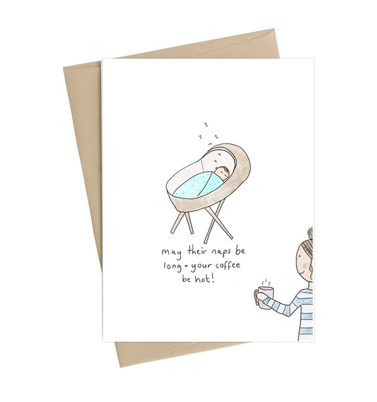 Greeting card with illustration of a baby in a crib and a person holding a coffee cup, with text 'May their naps be long, your coffee be hot!'. Little May Papery New Baby Card | Naps Be Long, Printed in Canada