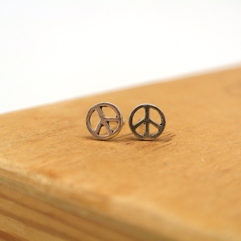 twang and pearl sterling silver studs peace cut out